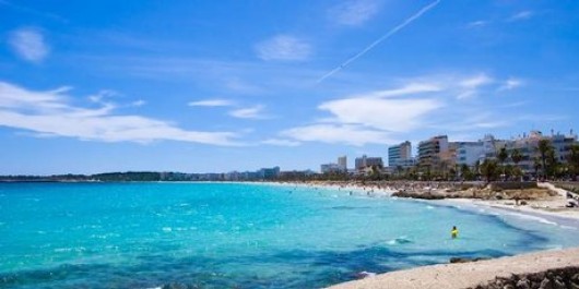 Cala Millor's promenade is lined with benches where Spaniards regularly meet of an afternoon to sit and watch the surf. Photo / Thinkstock