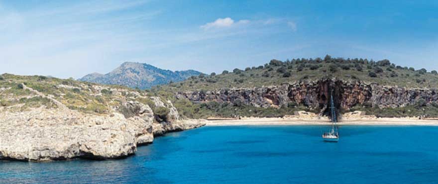 View of cove from the sea close to Cala Magrana Mar complex with apartments for sale