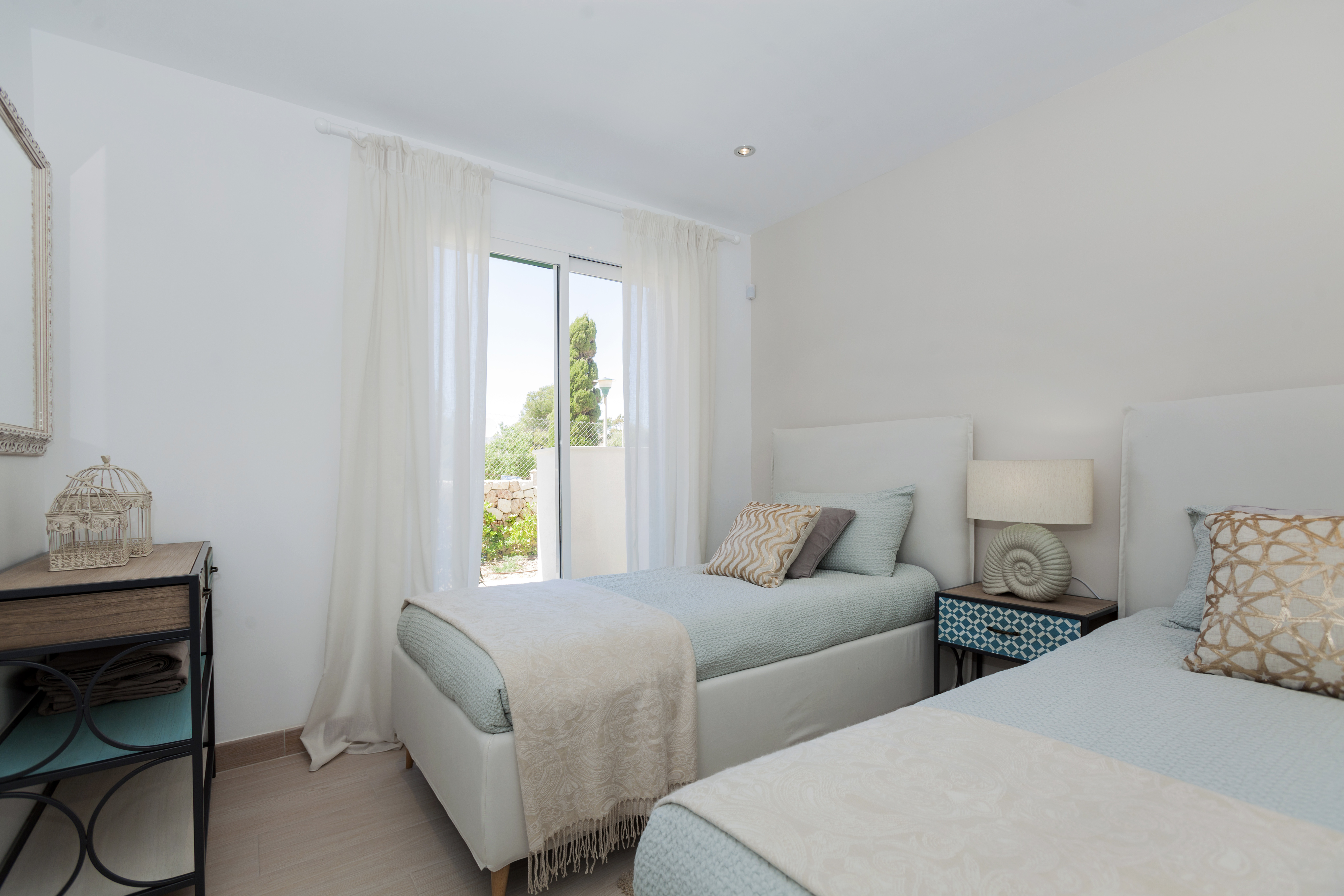 Luminous bedroom of Bahía San Pere apartments