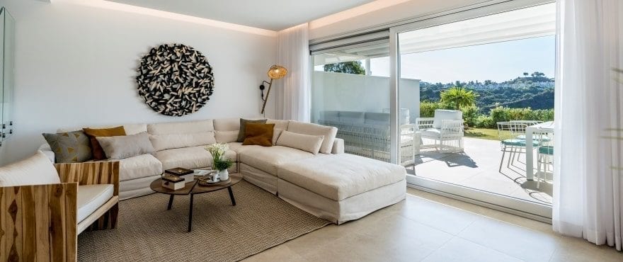 Bright living room with views of the golf course at the new townhouses for sale at Natura, Costa del Sol