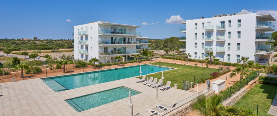 Compass, communal pool and gardens, next to the marina in Cala d´Or