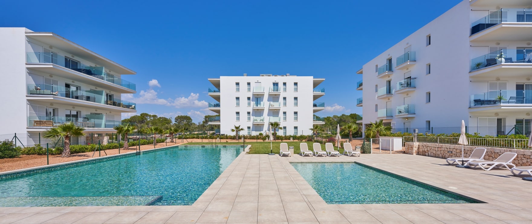 Compass, communal pool and gardens, next to the marina in Cala d´Or