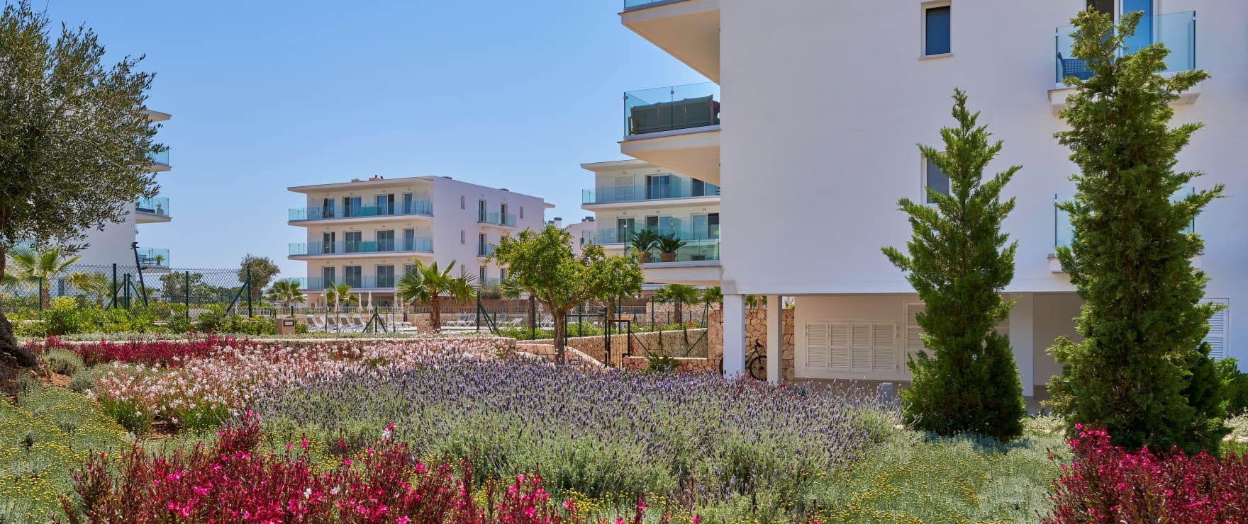 Compass, communal pool and gardens, next to the marina in Cala d´Or