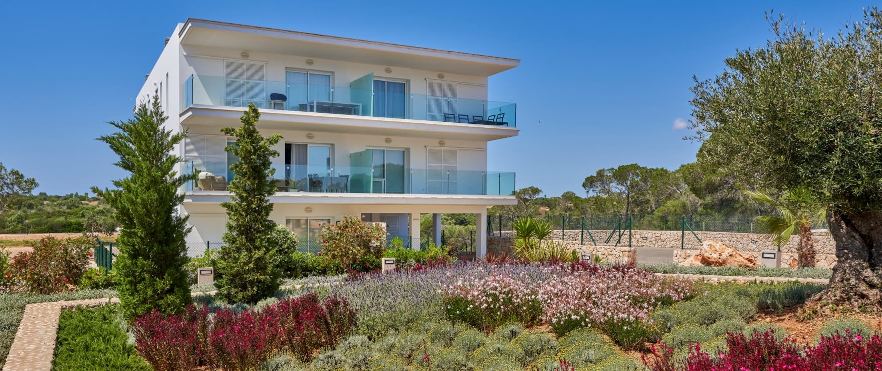 Compass, communal pool and gardens, next to the marina in Cala d´Or
