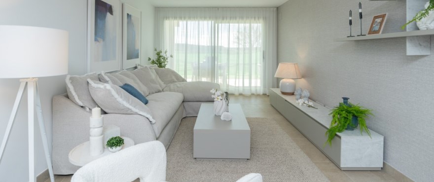Sunny Golf, bright living room at the new homes for sale at Estepona Golf. Southwest facing