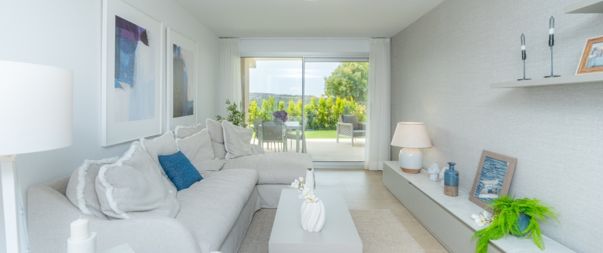 Sunny Golf, bright living room at the new homes for sale at Estepona Golf. Southwest facing