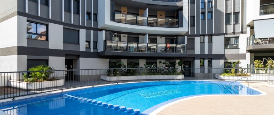 Modern apartments for sale in Jávea, with communal pools and gardens.
