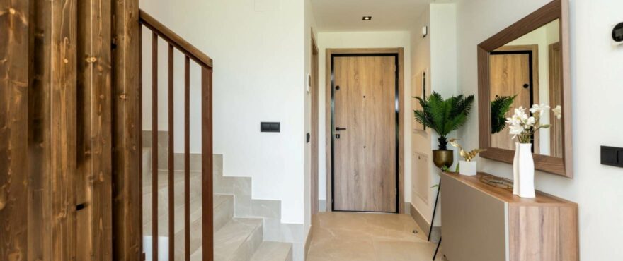 Bright living room with views of the golf course at the new townhouses for sale at The Meadows, Costa del Sol.