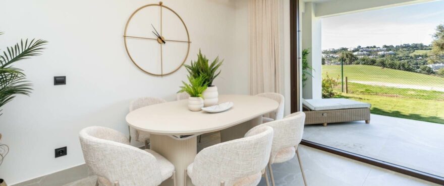 Bright living room with views of the golf course at the new townhouses for sale at The Meadows, Costa del Sol.