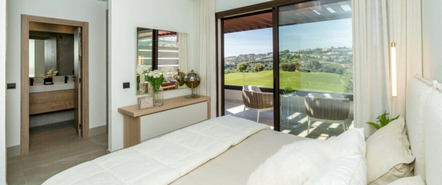 Bright bedroom with views of the golf course at The Meadows.