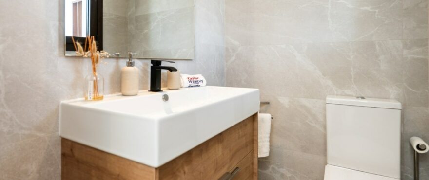 Modern, fully equipped bathroom with shower in the townhouse at The Meadows.